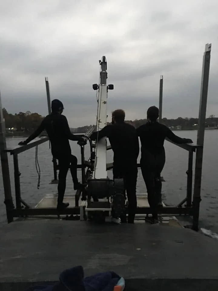 Tom's crew installing a lift from the barge
