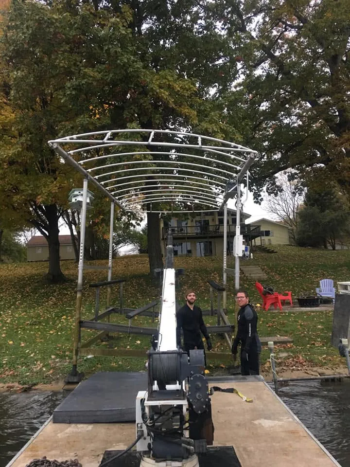 Crew working on a boat lift canopy frame